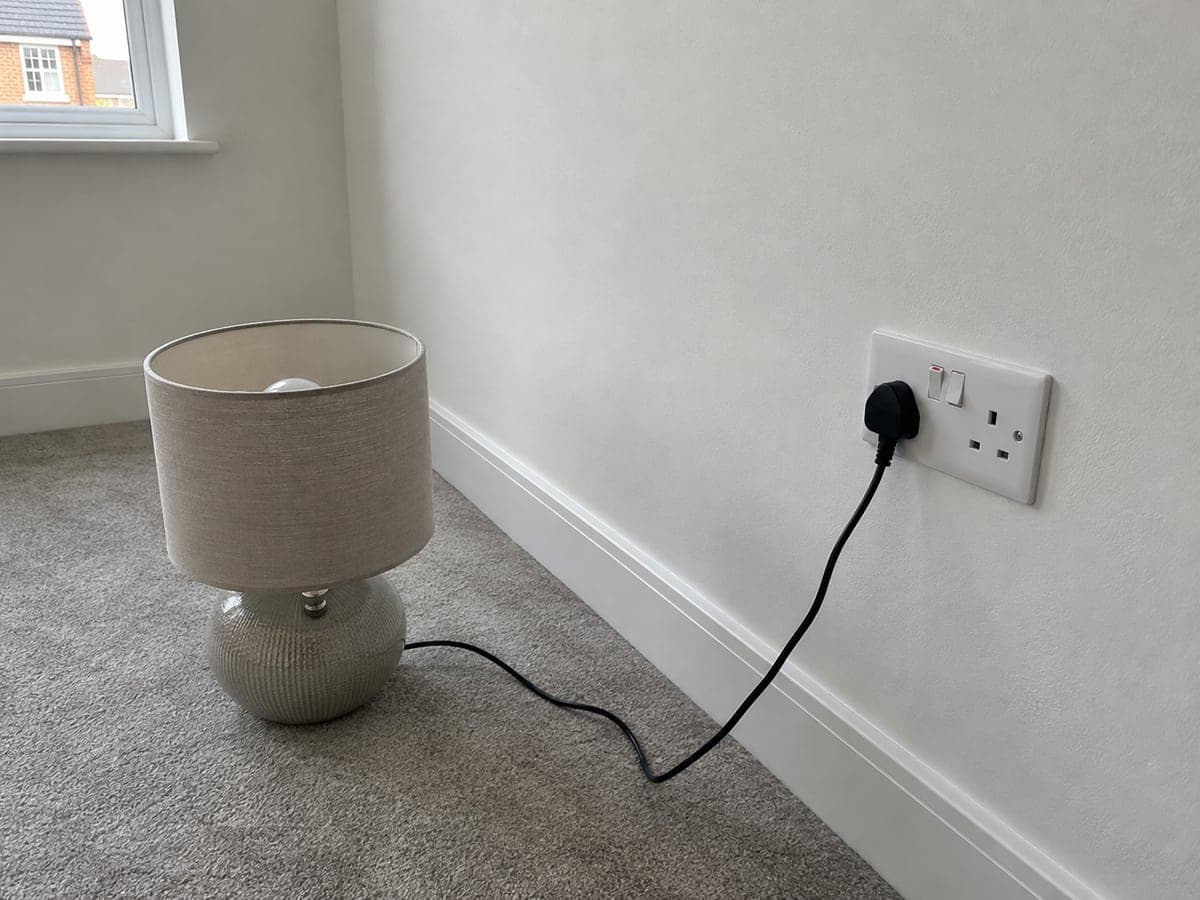 A lamp that worked at a neighbouring socket did not illuminate from either outlet of the low-level double socket beside the window, with the socket switches on.